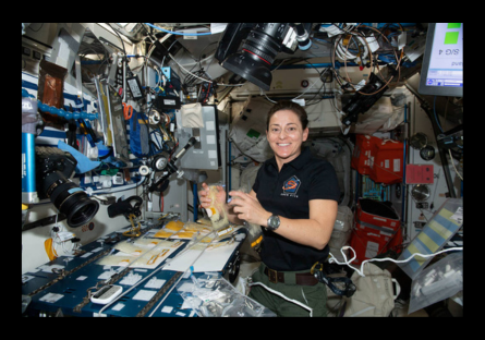 Colonel Mann working inside the space station.