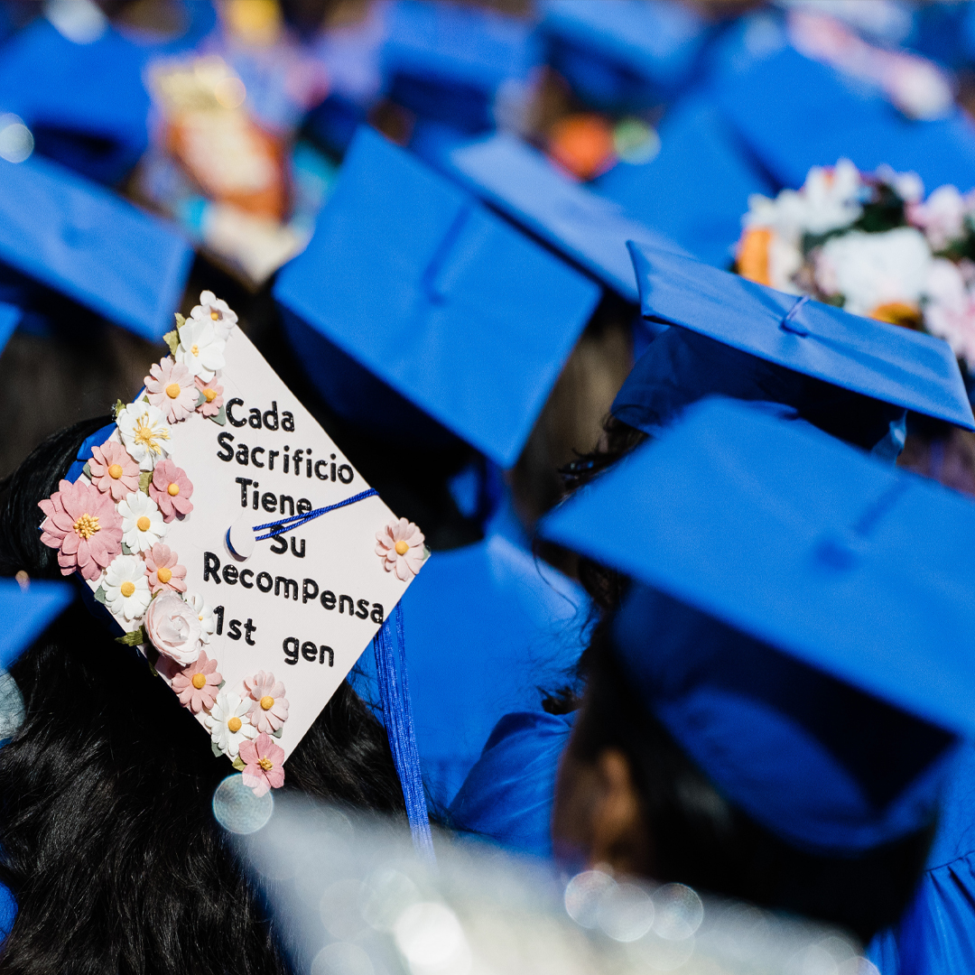 image of students with decorated mortarboard