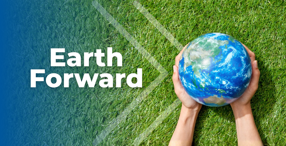 Image of hands holding a globe with the text "Earth Forward"