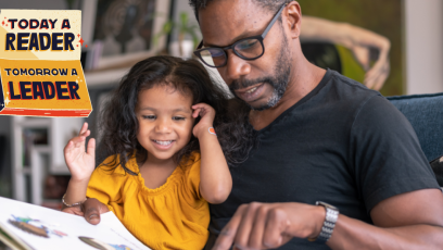 Father and daughter reading a book