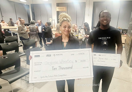 Cheyenne, Wheatley, and Xavier holding their prize money checks