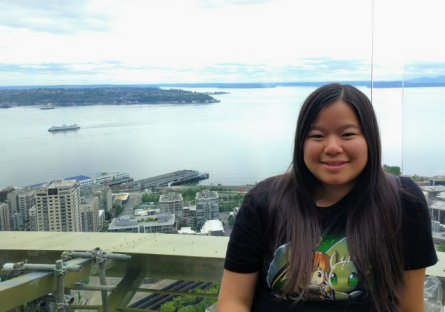 Photo of Jenny Wong with city view.