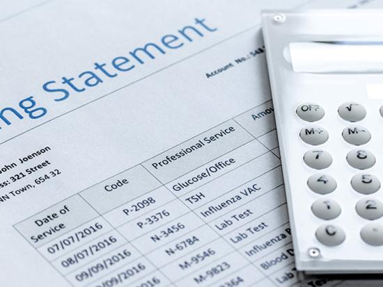 Photo of medical bill and calculator