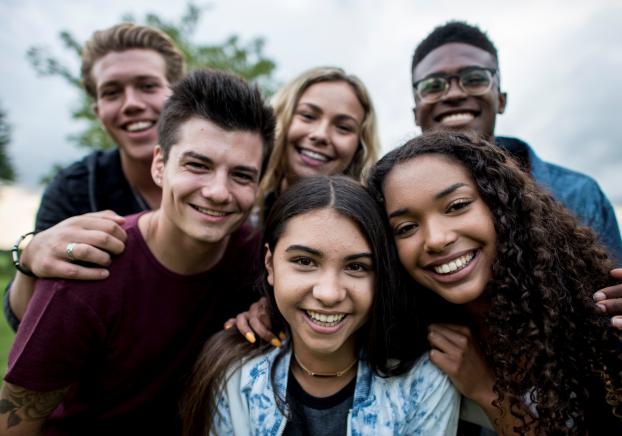 A group of students smiling at the camera