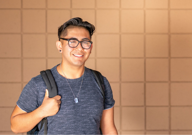 Student with backpack outside